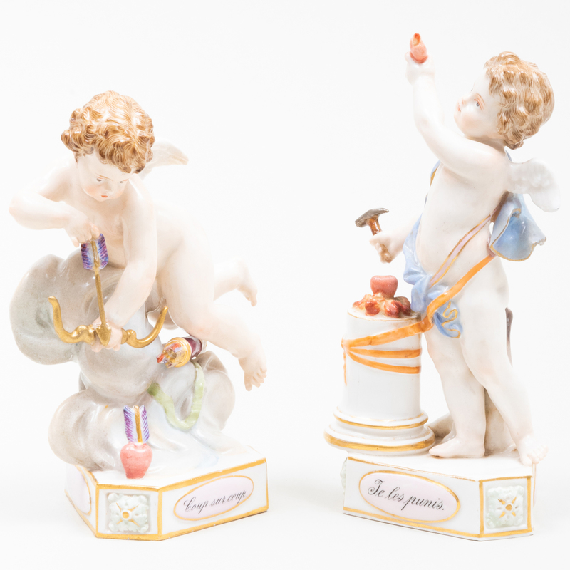 Appraisal: PAIR OF MEISSEN PORCELAIN PUTTI FIGURES Blue crossed swords mark