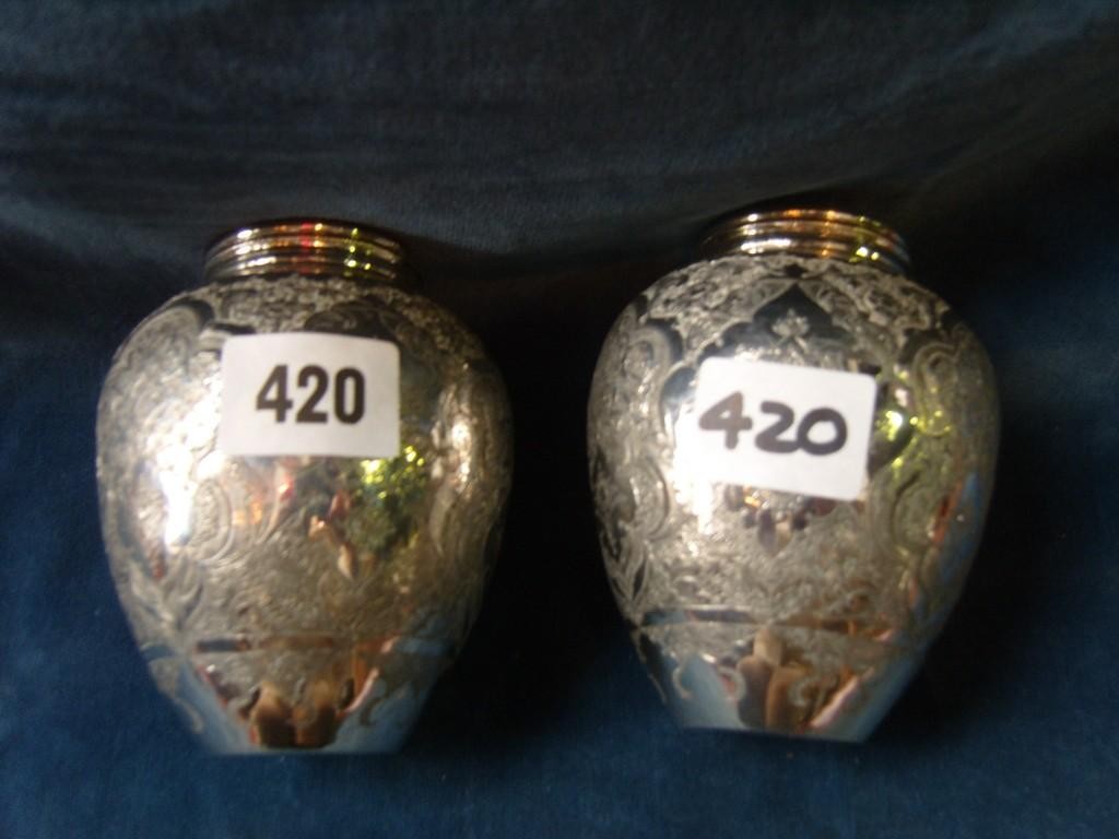 Appraisal: A pair of good quality middle eastern white metal vases