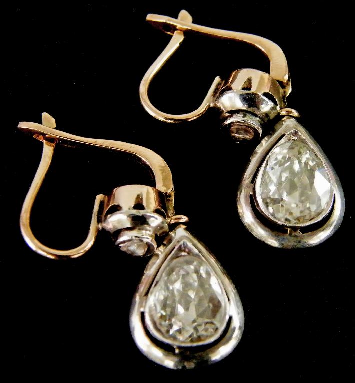 Appraisal: Pair of ct and silver set diamond earrings each with