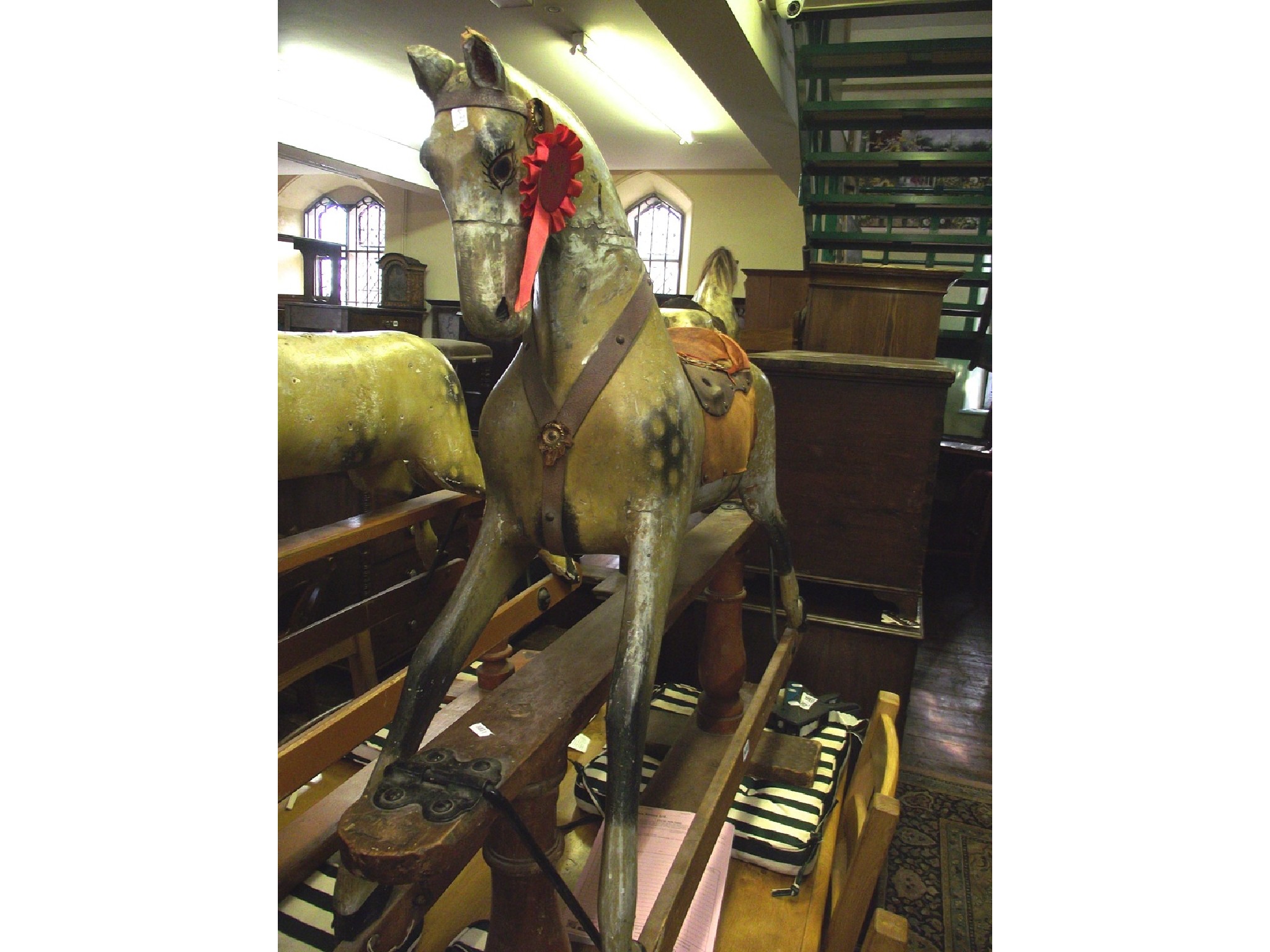 Appraisal: An Edwardian dapple grey rocking horse raised on a pine