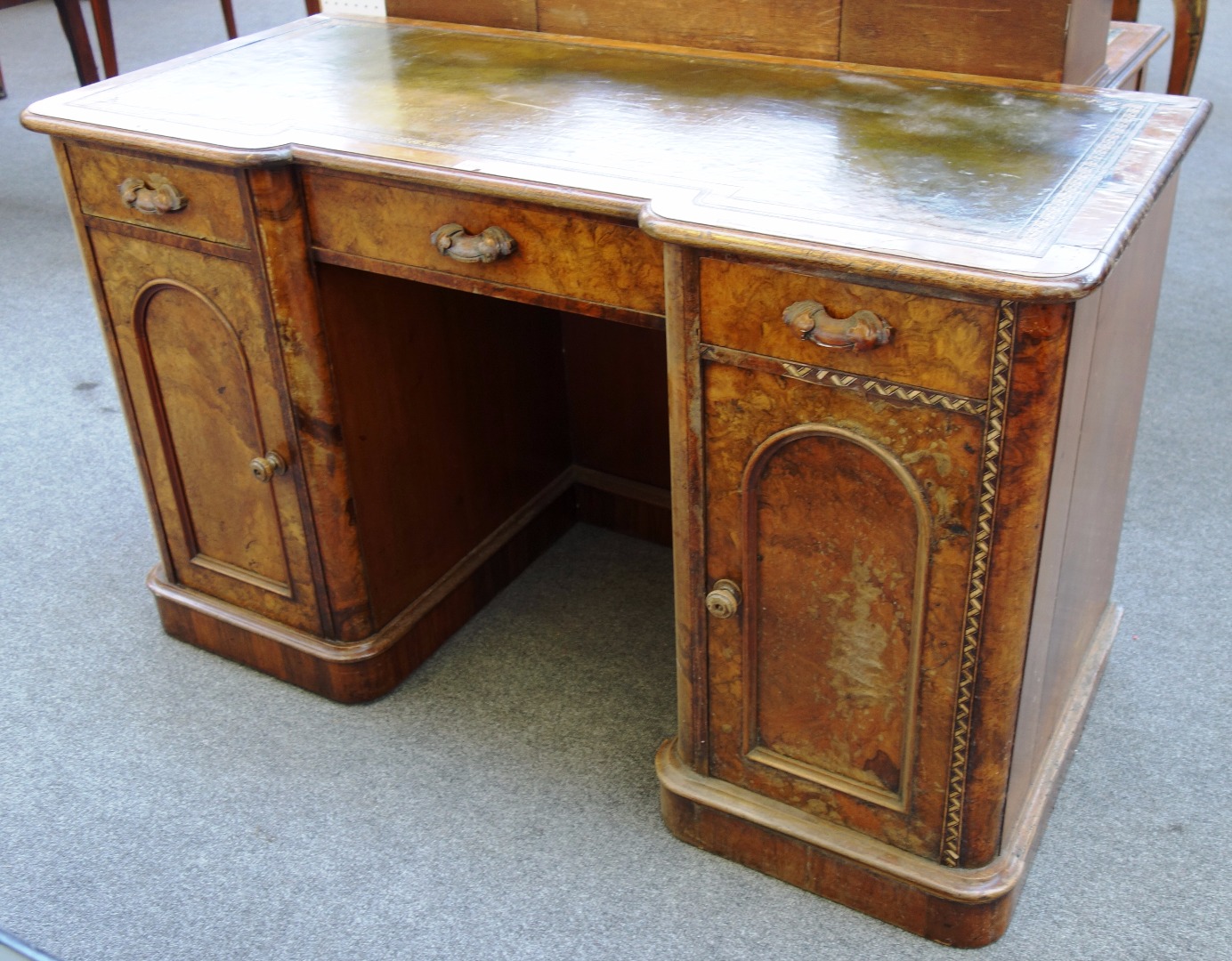 Appraisal: A th century walnut inverted breakfront writing desk with three