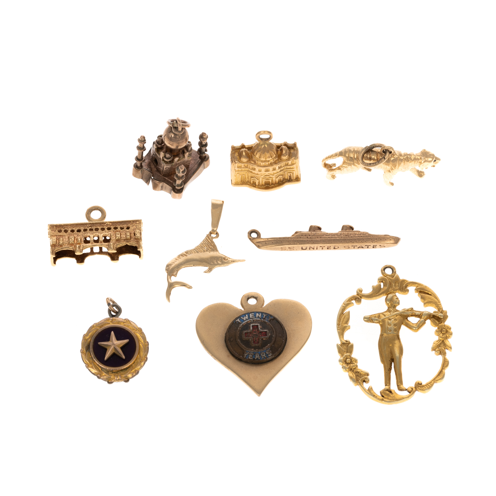 Appraisal: A COLLECTION OF GOLD GOLD-FILLED CHARMS Three K yellow gold