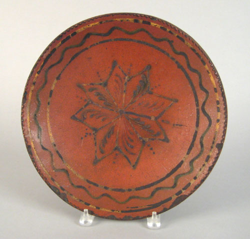 Appraisal: Pennsylvania or Maryland redware charger th c with slip decorated