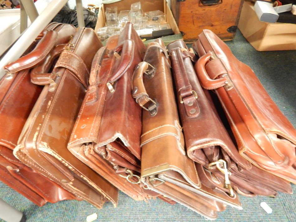 Appraisal: Seven leather briefcases or satchels some with brass fittings etc