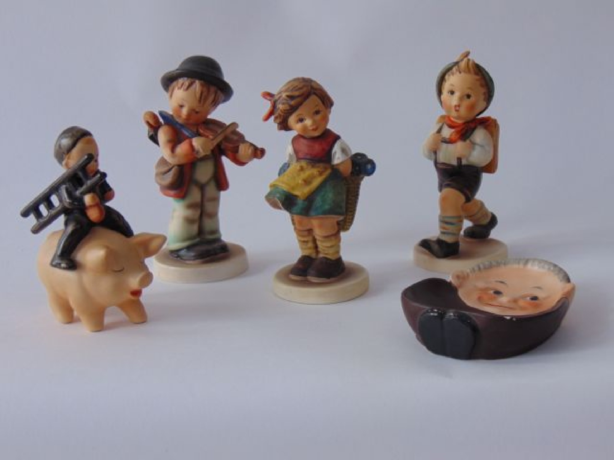 Appraisal: A collection of Goebel Hummel figures including a boy sweep