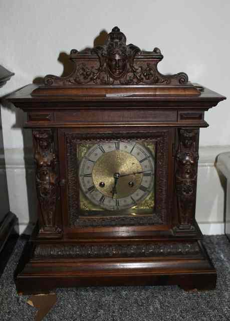 Appraisal: A VICTORIAN WALNUT MANTEL CLOCK with carved cornice and column