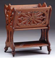 Appraisal: VICTORIAN WALNUT CANTERBURY The American piece having pierced carved design