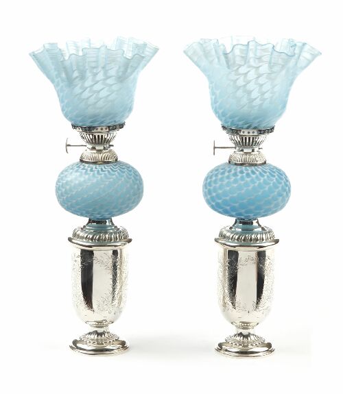 Appraisal: A pair of Victorian opaque glass and silver plated paraffin