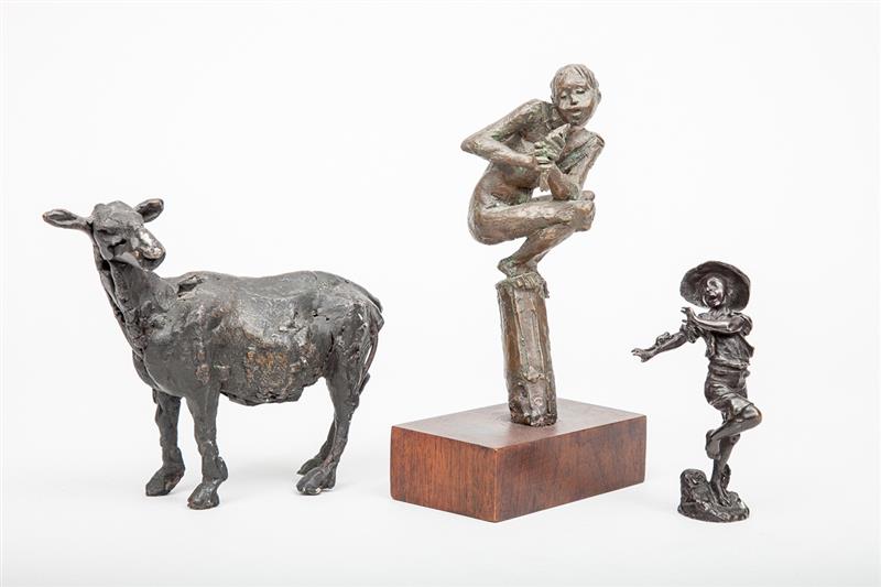 Appraisal: Three Bronze Figural Sculptures Comprising a German group of boy