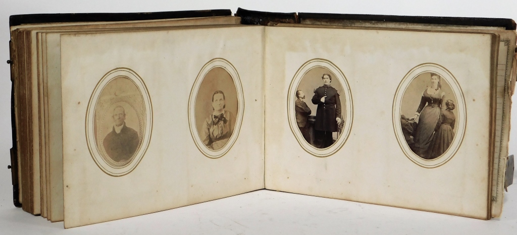 Appraisal: PHOTO ALBUM WITH TINTYPE AND PAPER PORTRAITS Photo album with