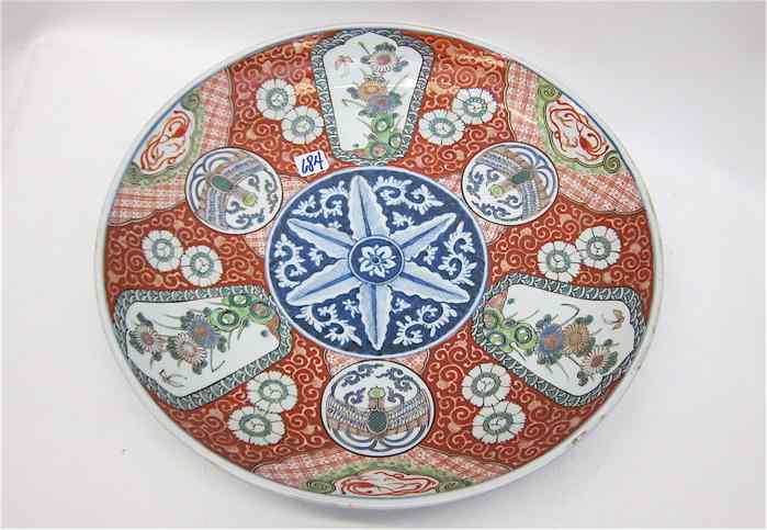 Appraisal: JAPANESE IMARI PORCELAIN CHARGER with hand painted alternating reserves of