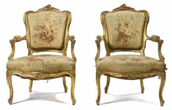 Appraisal: A Pair of Louis XV Style Giltwood Fauteuils each having