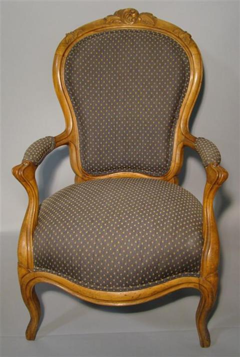 Appraisal: LOUIS XV STYLE FRUITWOOD FAUTEUIL the leaf carved shaped crest