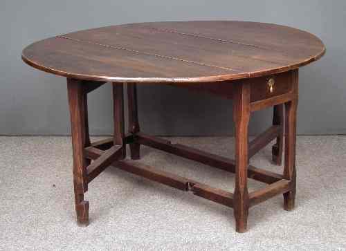 Appraisal: An th Century oak oval gateleg table fitted single frieze