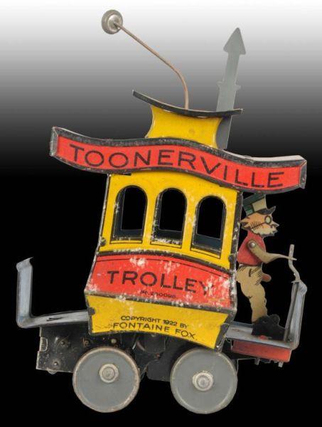 Appraisal: German Nifty Tin Wind-Up Toonerville Trolley Toy Description Original pull