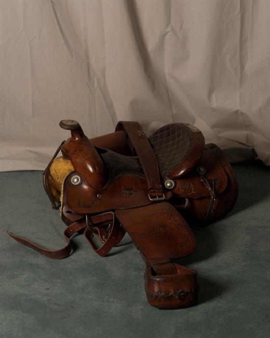 Appraisal: Western Saddle with silver adornments tooled leather with western scenes