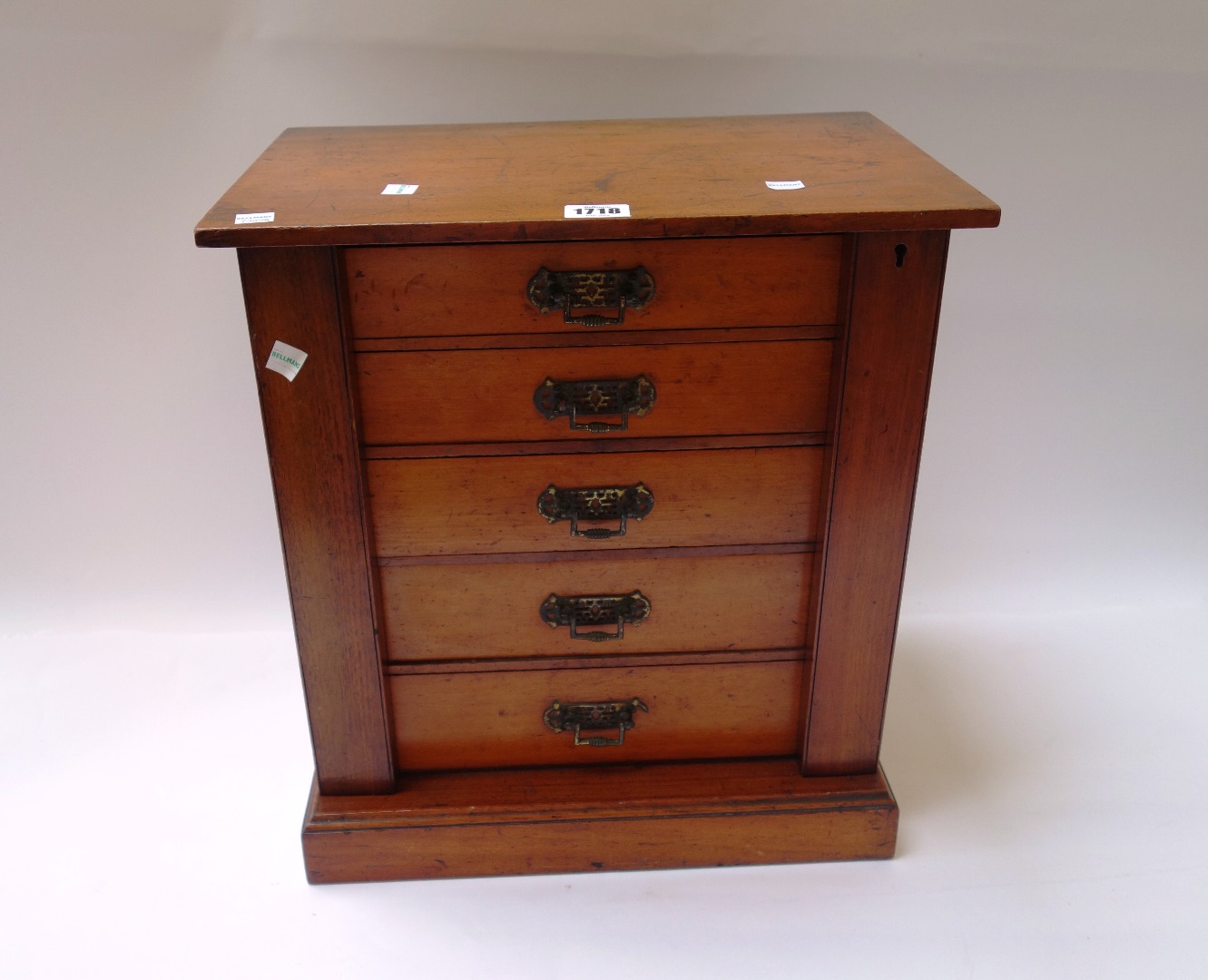 Appraisal: An Edwardian mahogany table top Wellington chest of five drawers