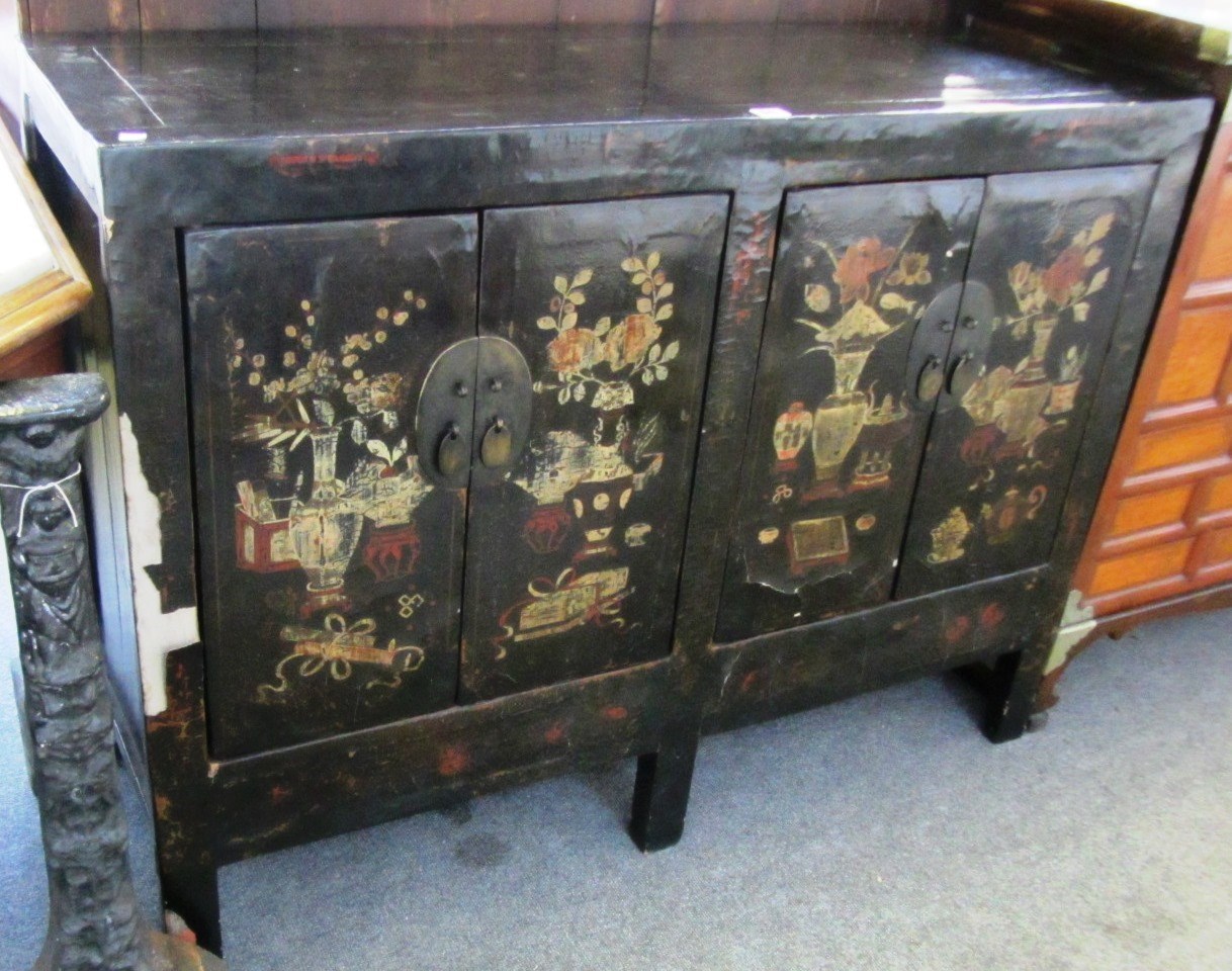 Appraisal: An early th century Chinese black lacquer chinoiserie decorated four