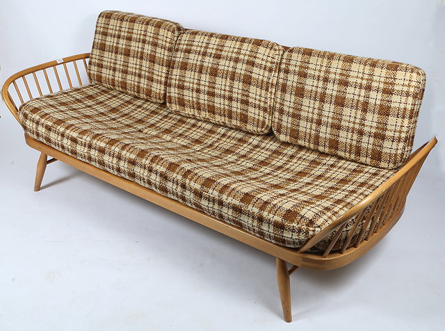 Appraisal: AN ERCOL LIGHT ELM DAY BED single plank back spindle