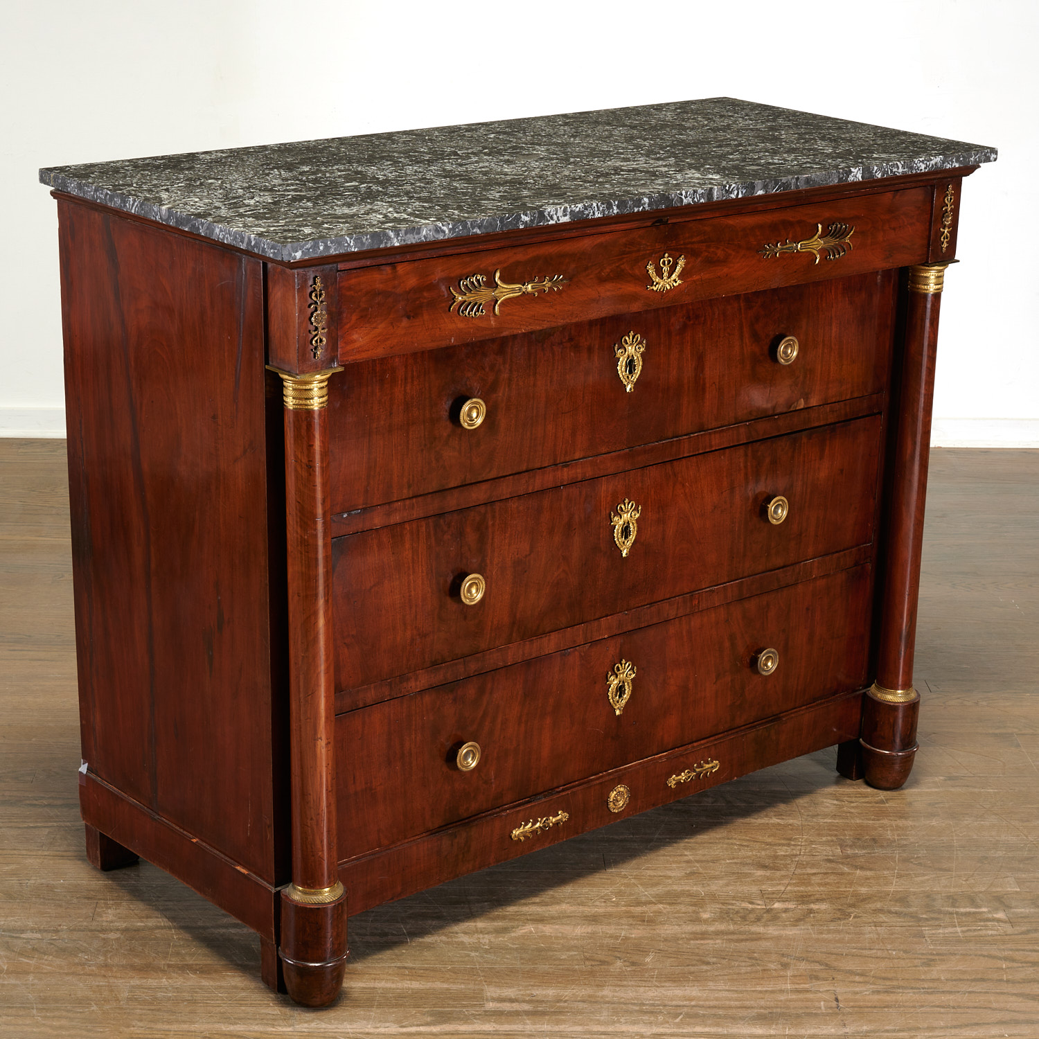 Appraisal: FRENCH EMPIRE MARBLE TOP MAHOGANY COMMODE th c France ormolu-mounted