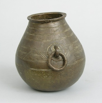 Appraisal: An Asymmetrical Bronze Vase A hand-wrought bronze container with a