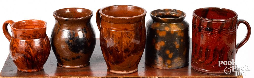 Appraisal: Five pieces of Pennsylvania redware th c Five pieces of