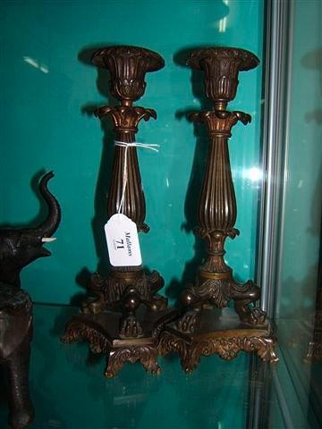 Appraisal: A pair of th Century Continental cast bronze candlesticks of