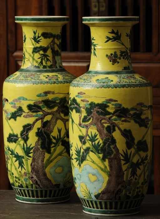 Appraisal: PAIR OF CHINESE FAMILLE VERTE YELLOW-GROUND PORCELAIN BALUSTER-FORM VASES in