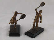 Appraisal: A pair of cast bronze male and female tennis players