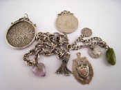 Appraisal: A silver fob Birmingham two silver charm bracelets and two