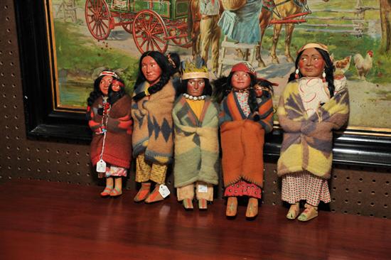 Appraisal: FIVE SKOOKUM DOLLS Four female figures with children One male