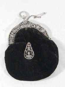 Appraisal: A Dutch silver mounted velvet evening bag the heavy mounts