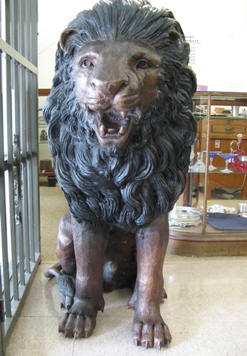 Appraisal: LIFE-SIZE BRONZE WILDLIFE SCULPTURE an African male lion cast in