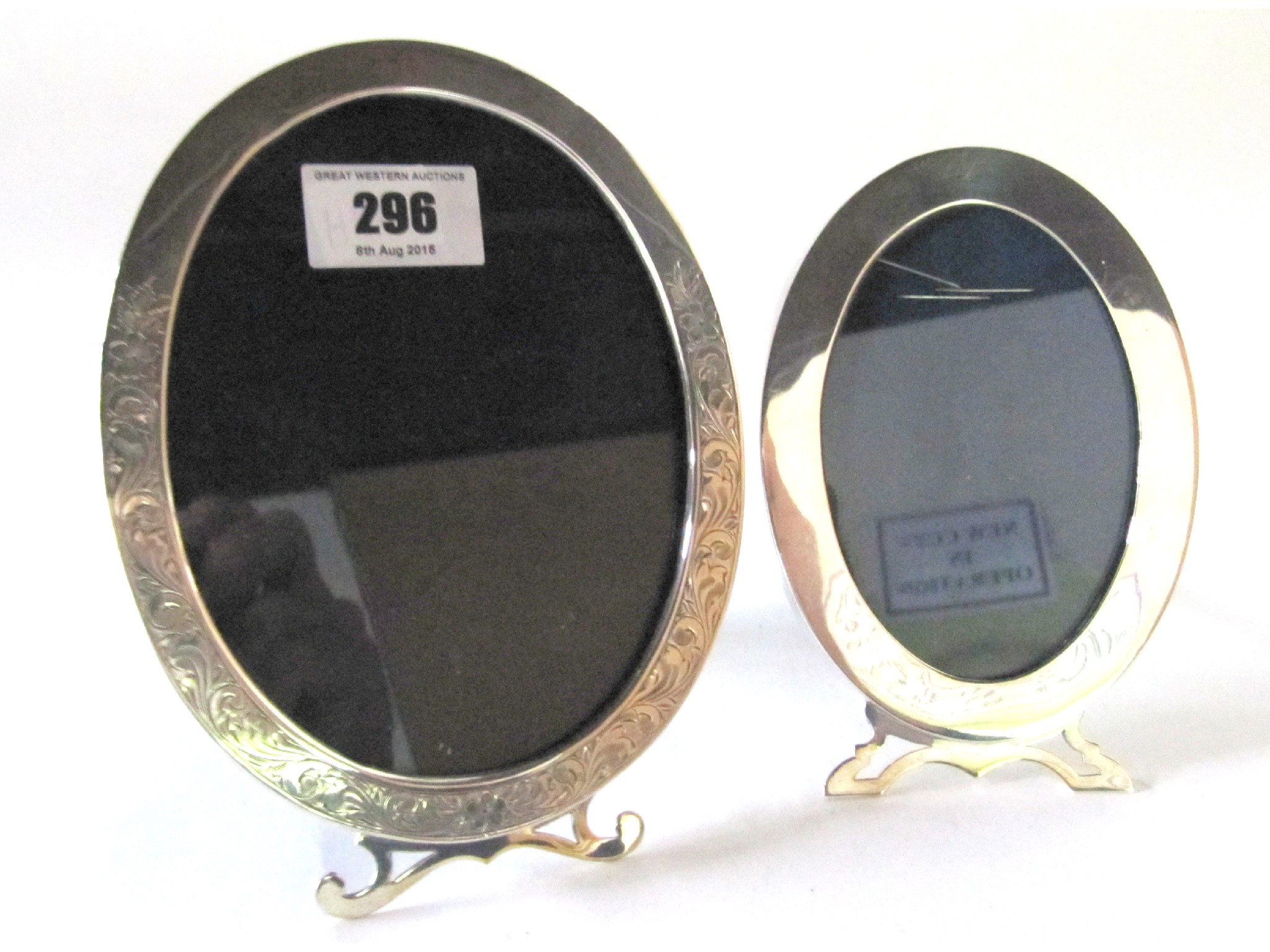 Appraisal: A lot comprising two sterling silver mounted oval photo frames