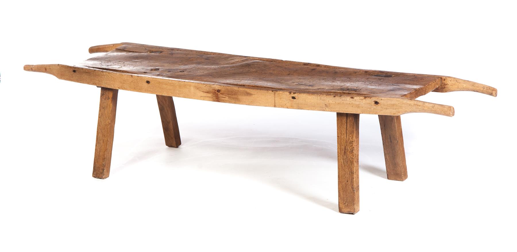 Appraisal: CONTINENTAL LOW TABLE Late th century elm Butcher's board coverted