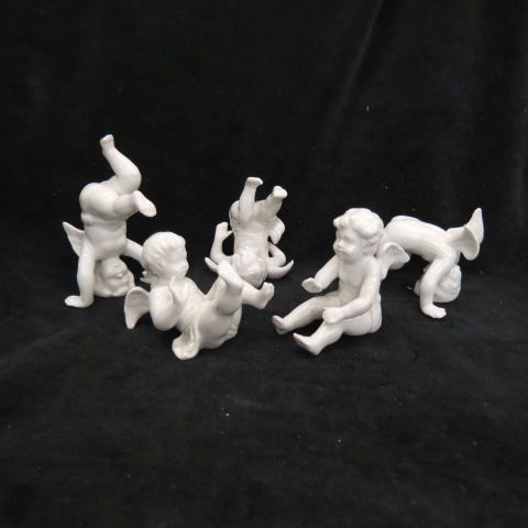 Appraisal: Set of Porcelain Cherub Figurines white overglaze most excellent