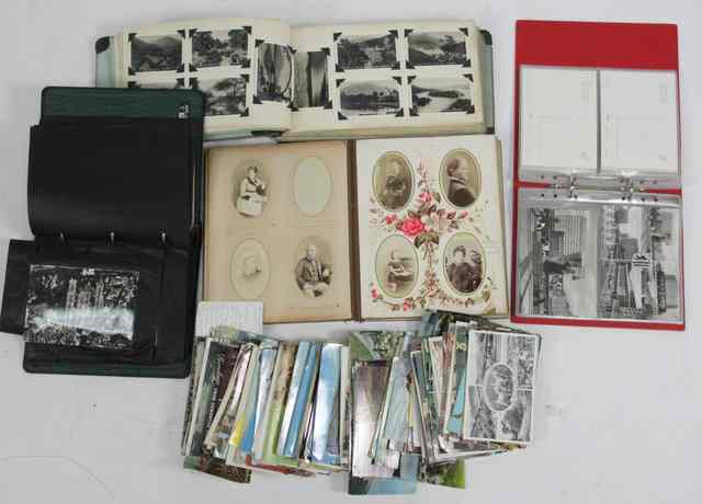 Appraisal: A Victorian photograph album three postcard albums and a quantity