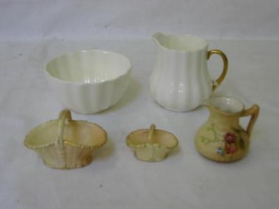 Appraisal: TWO ROYAL WORCESTER BLUSH PORCELAIN MINIATURE BASKETS and wide a