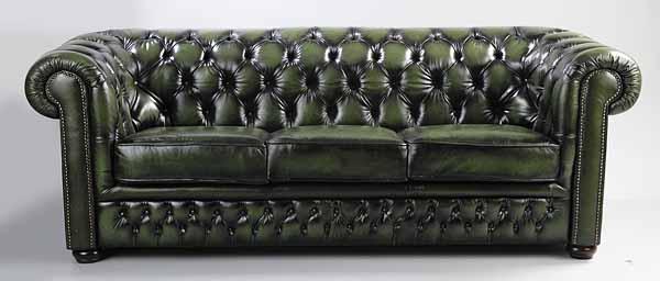 Appraisal: A Green Chesterfield Sofa of typical form with tufted back