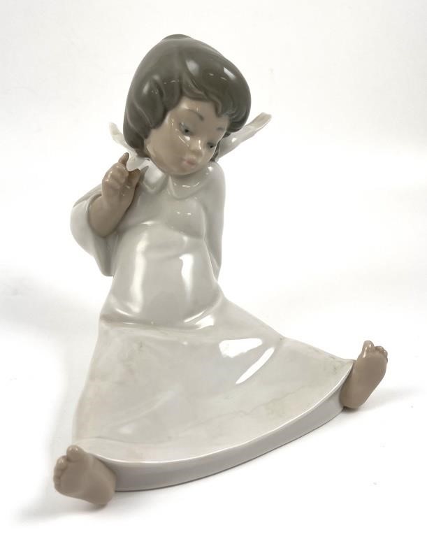 Appraisal: Retired Lladro gloss porcelain figurine of an angel wondering Approx