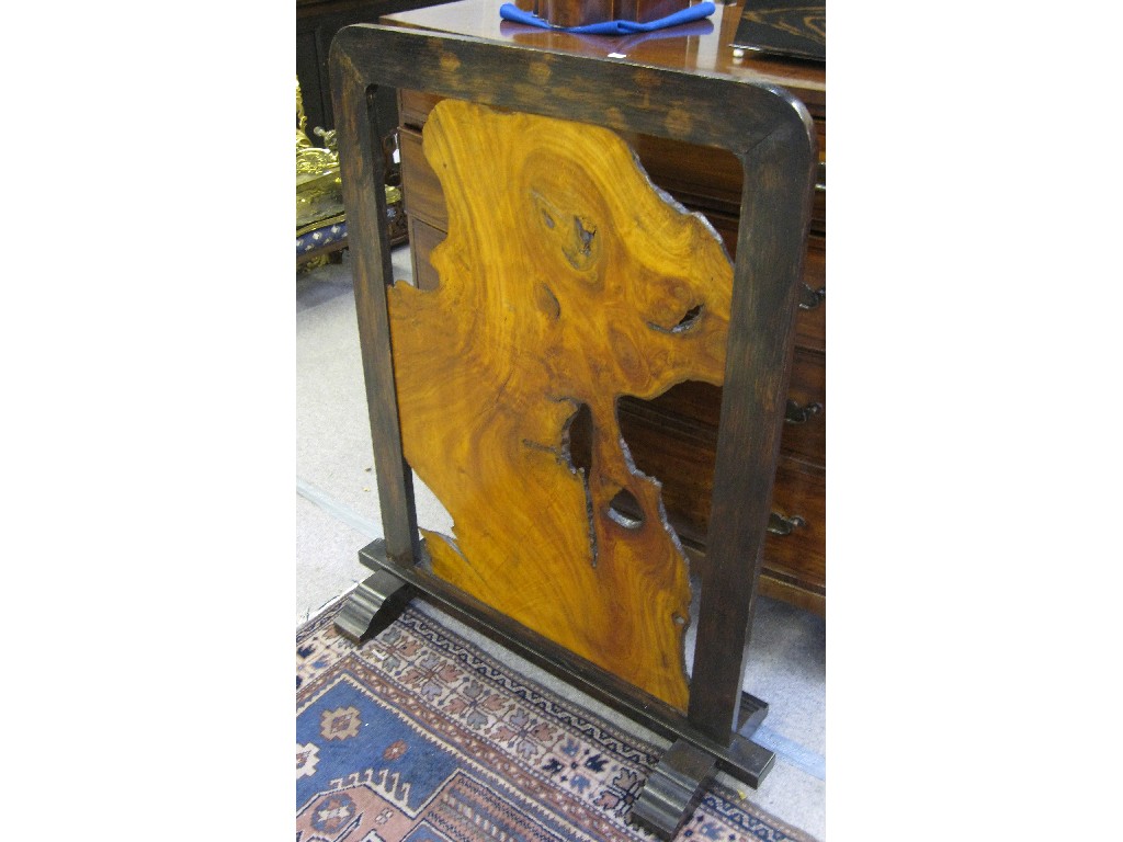 Appraisal: Unusual wooden fire screen the frame inset with a naturalistic