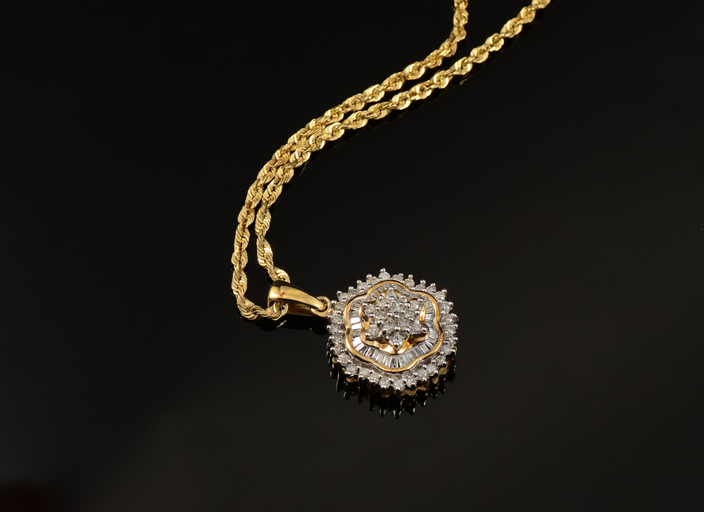 Appraisal: DIAMOND PENDANT NECKLACE K yellow gold pendant with a showy