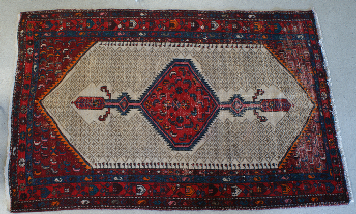 Appraisal: x worn red oriental throw rug Estimate -