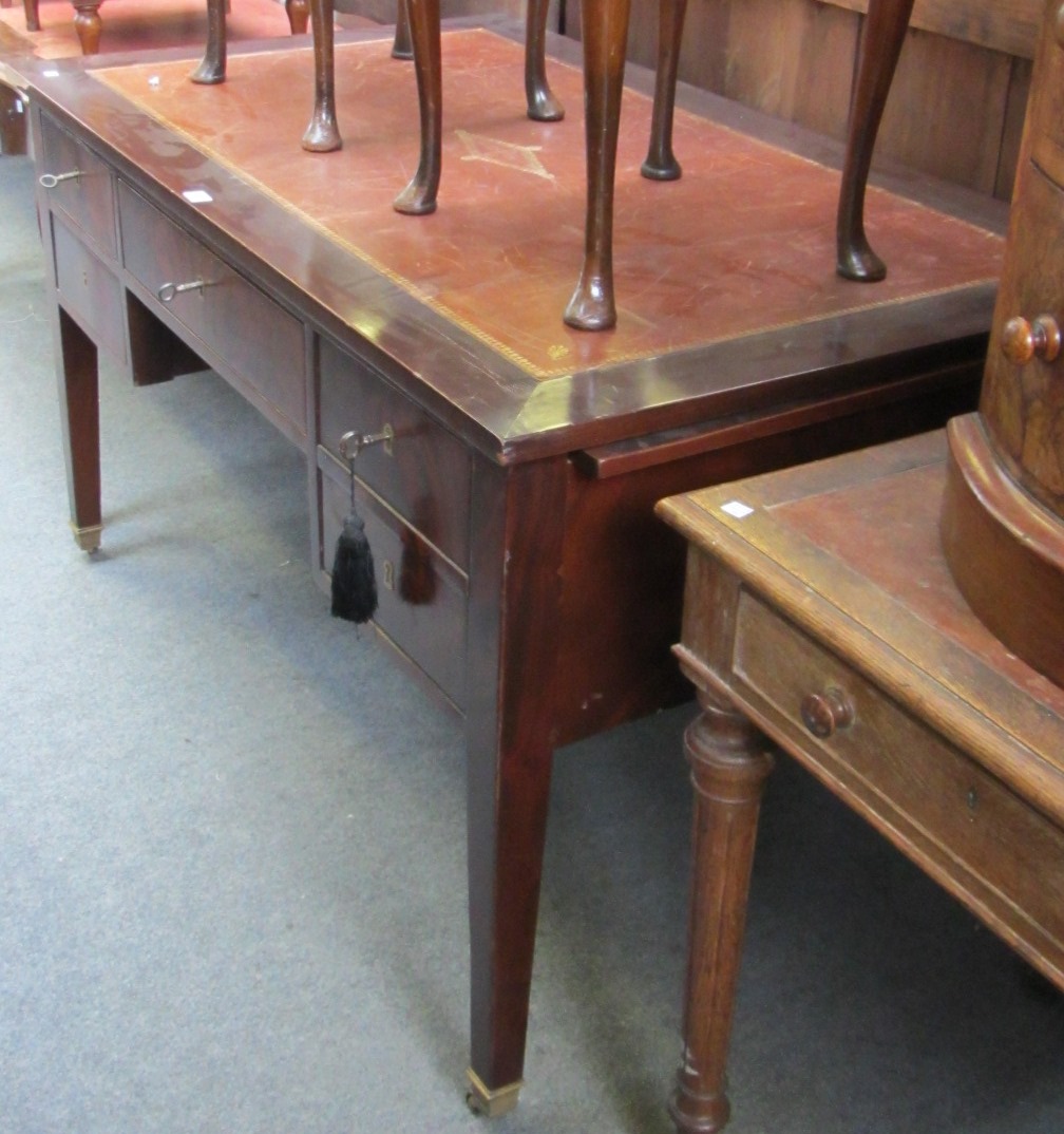 Appraisal: A th century French mahogany writing desk with four drawers