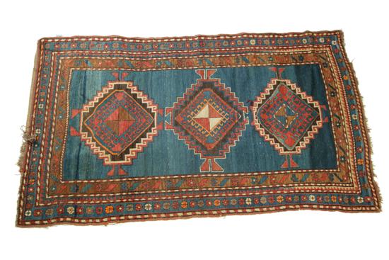 Appraisal: ORIENTAL RUG Ca Karak Multiple borders and abrash blue ground