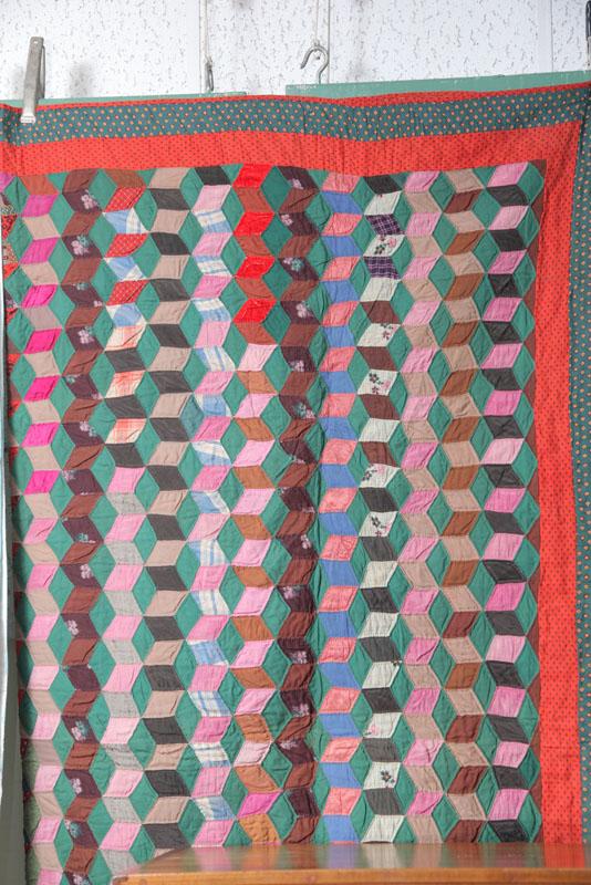 Appraisal: QUILT A Tumbling Block quilt primarily in green and pink