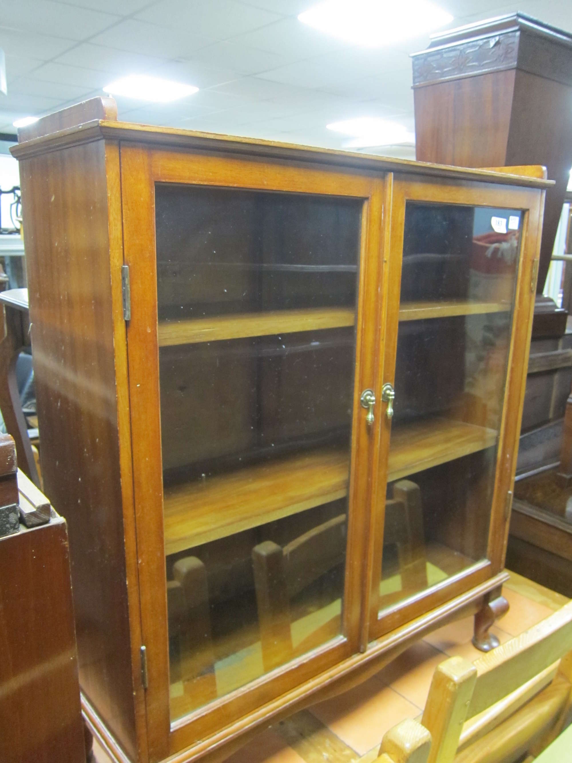 Appraisal: mahogany and glazed display cabinet on turned legs