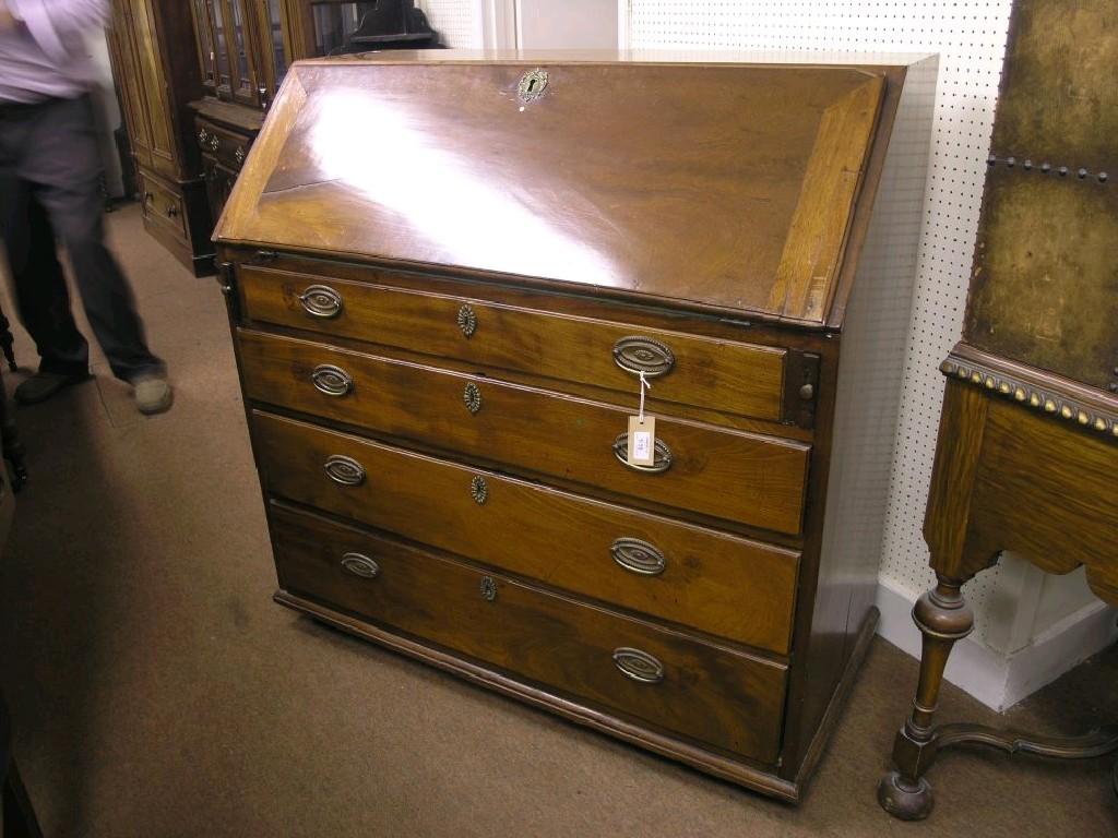 Appraisal: A George III Cuban mahogany bureau fall-front enclosing an arrangement