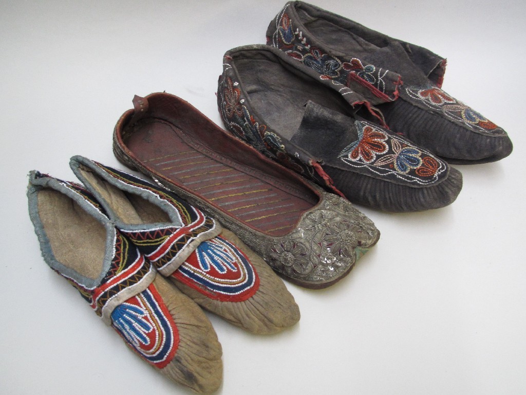 Appraisal: A pair of moccasins with coloured threads of foliage an