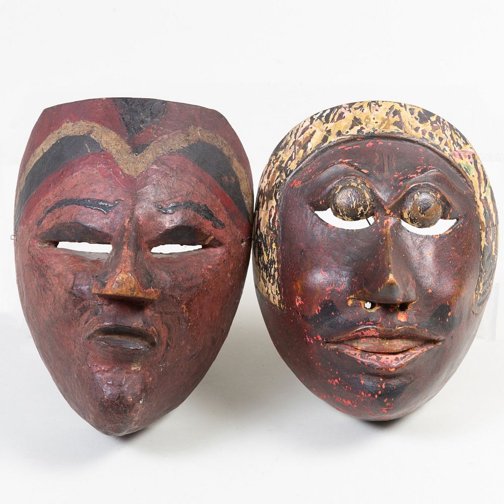 Appraisal: Two Indonesian Painted Wood Masks The larger in high Property